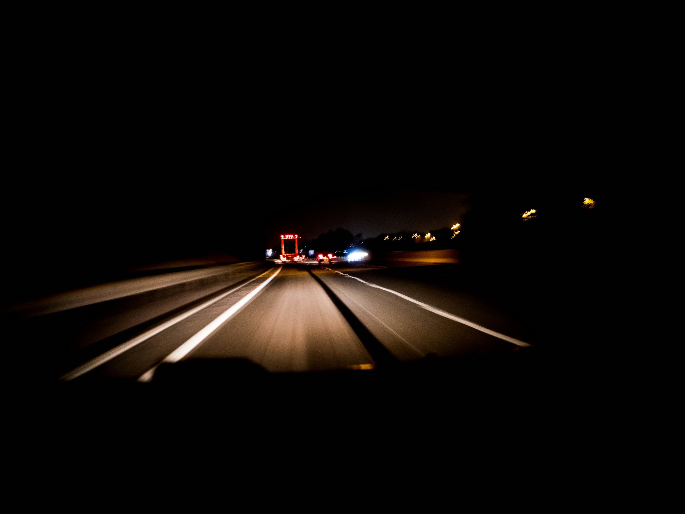 A motorway at night, seen from the driver’s seat
